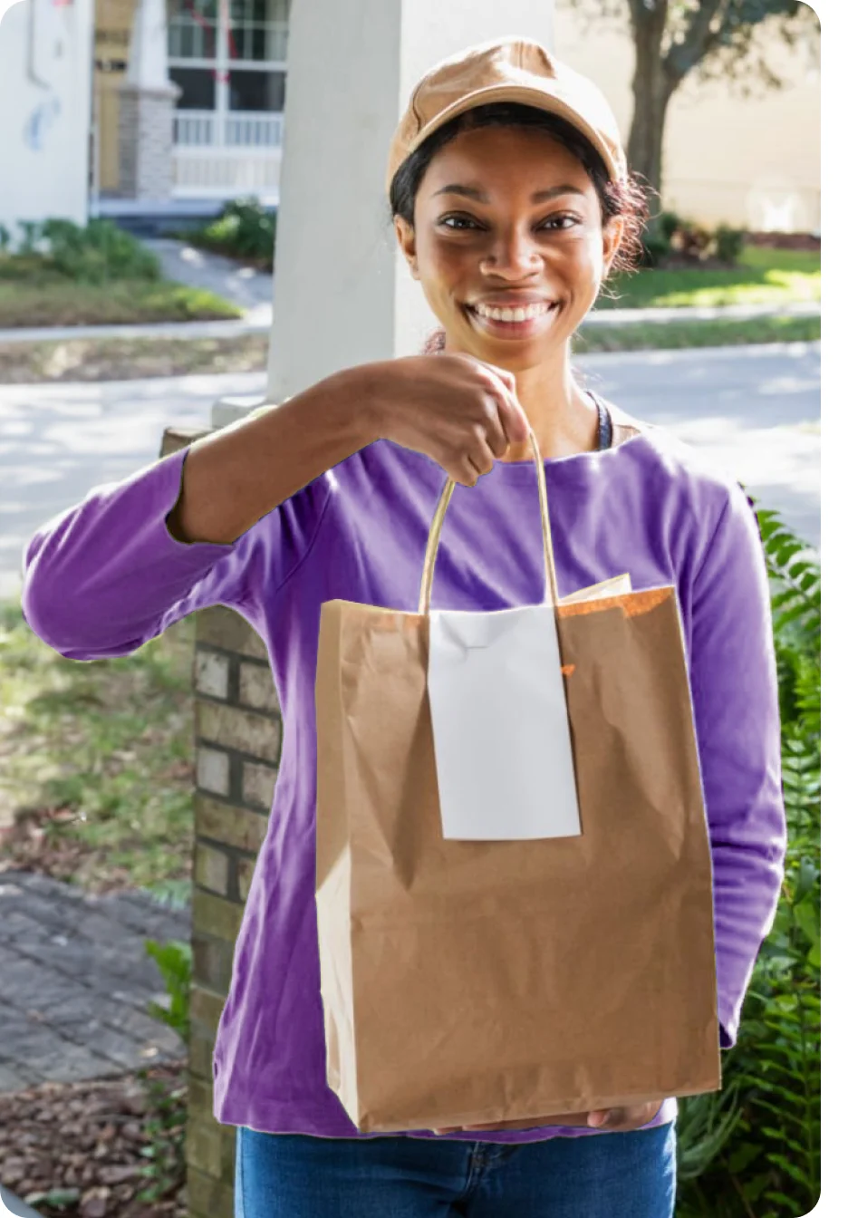 A food delivery person is at the door with an order. 