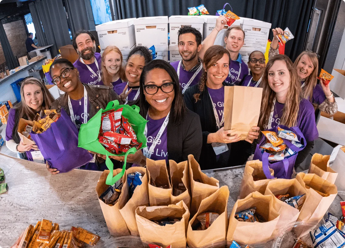 TELUS team members packing food.