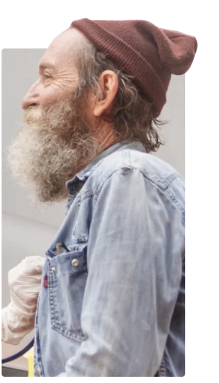 A bearded man wearing a toque